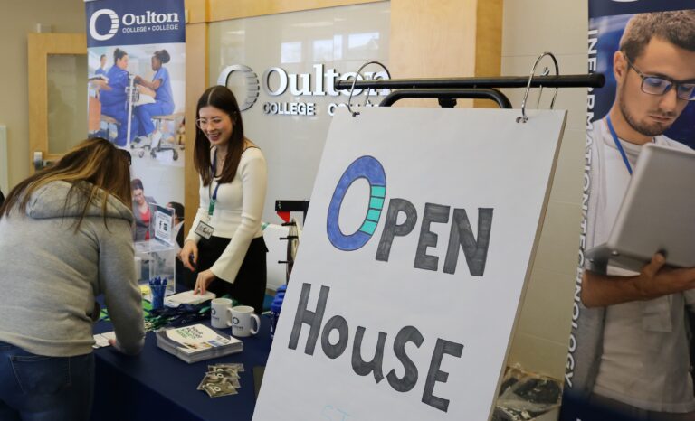 Community members engaging with faculty and students at an Oulton College open house event