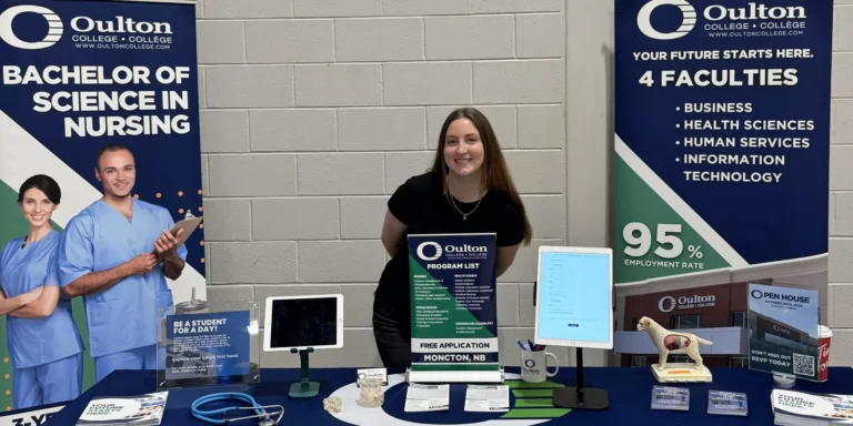 Admissions advisor standing among various programs available at Oulton College, surrounded by resources for students