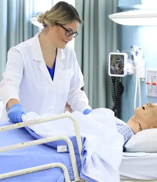 A Bachelor of Science in Nursing (BScN) students from Oulton College’s first cohort providing a testimonial in a lab setting, highlighting the hands-on learning approach of the accelerated three-year nursing program.