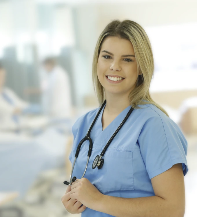 Practical Nursing Female Student, from Oulton College in her scrubs during a hands-on experience practical/ class. Oulton College Nursing School.