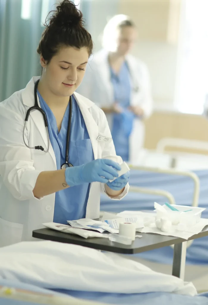 A Practical Nurse completing nursing practical.