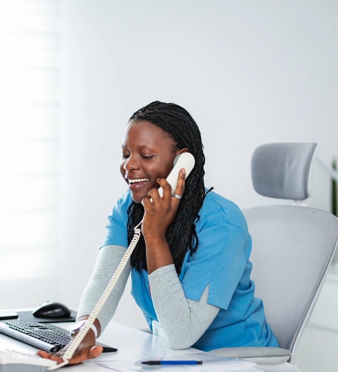 Medical Office Administration student at her OJT in a Medical office. Student is answering a call from a patient.