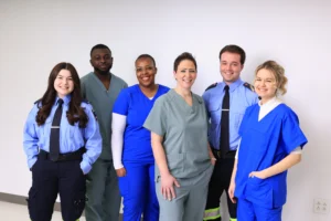 Students wearing uniform and scrubs from different Healthcare profession's.